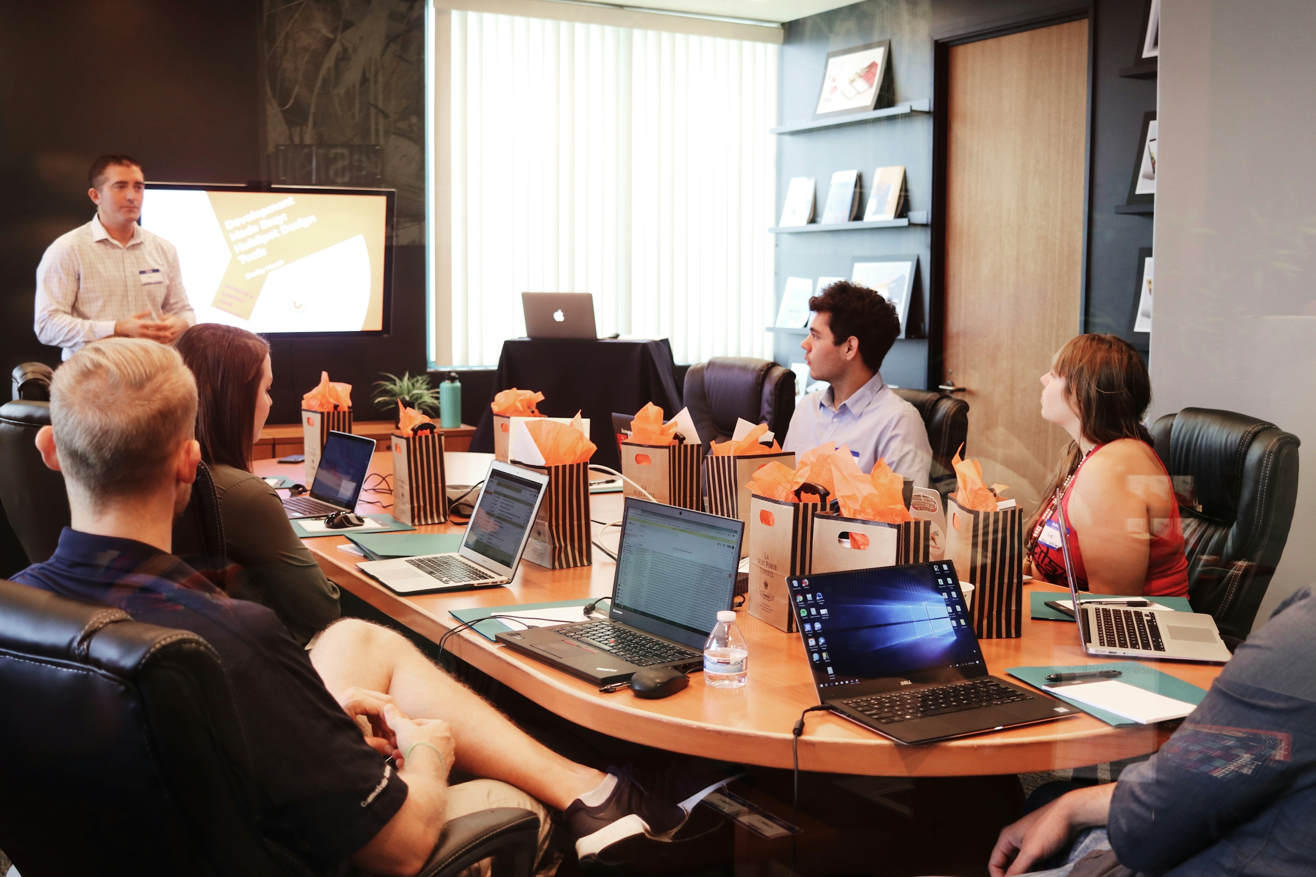 Team planning procurement and delivery schedules